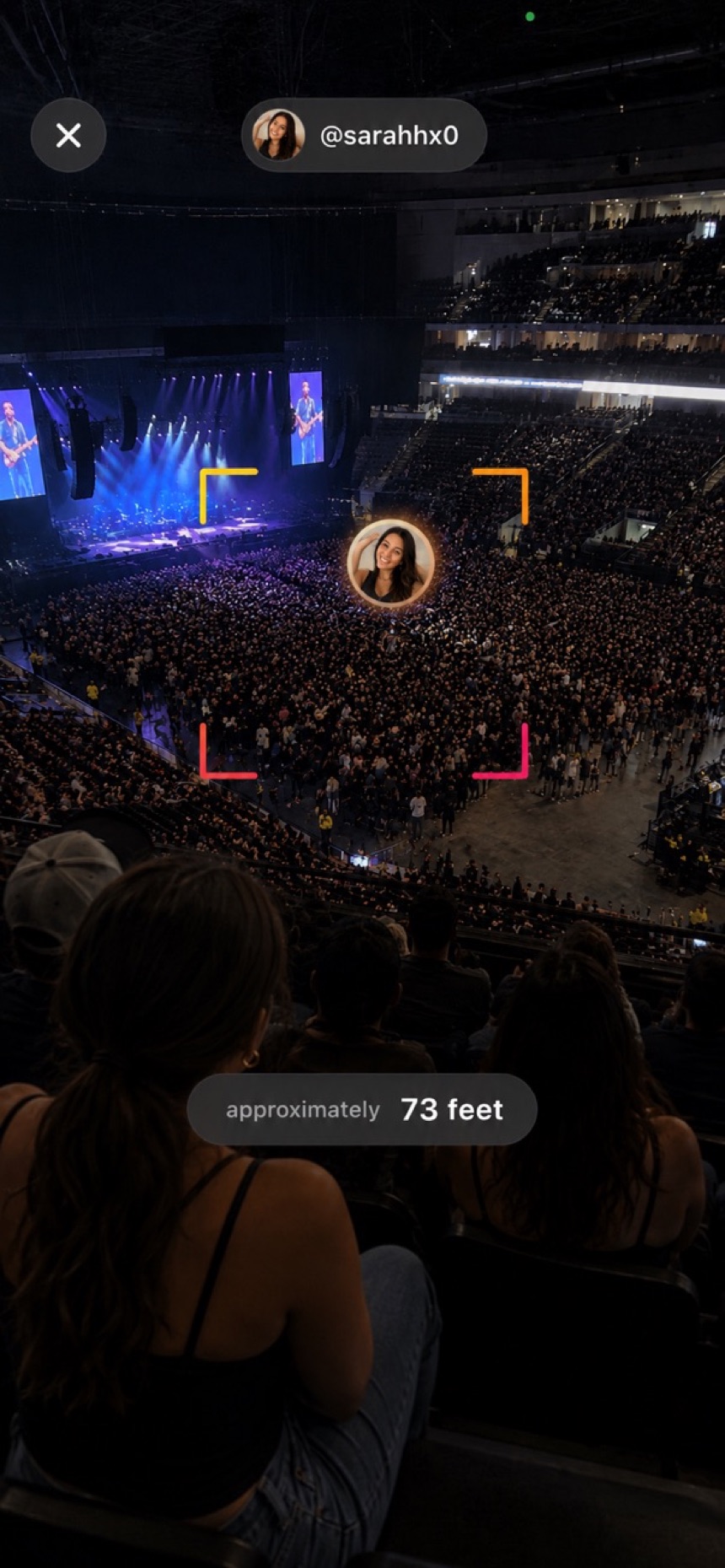 The Proximitii Finder locating a friend in a packed concert crowd — approximately 73 feet.